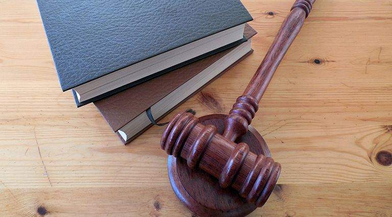Do I need to respond or answer if the defendants lawyer is asking the court to dismiss my case with prejudice?